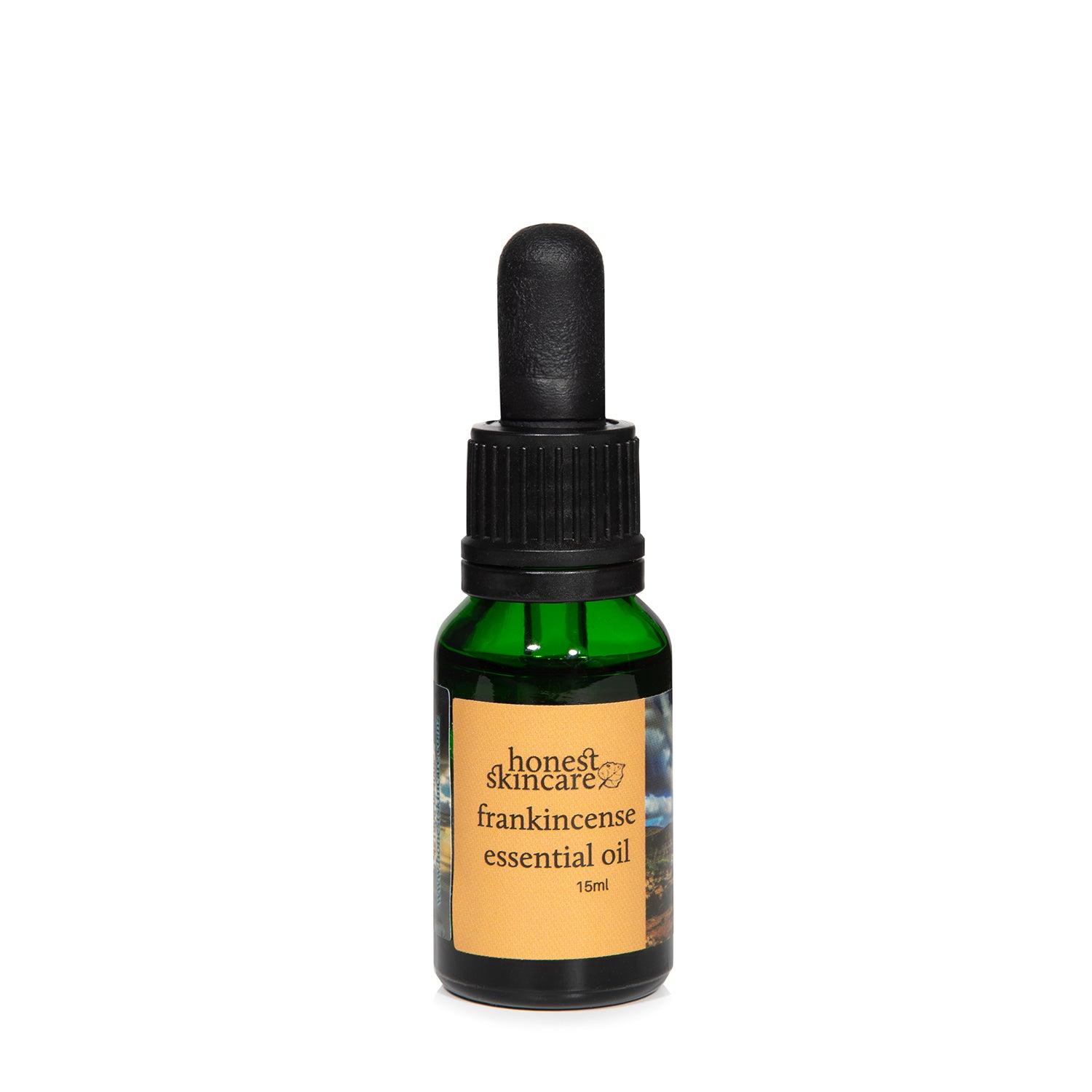 Honest Skincare frankincense essential oil bottle on a white background