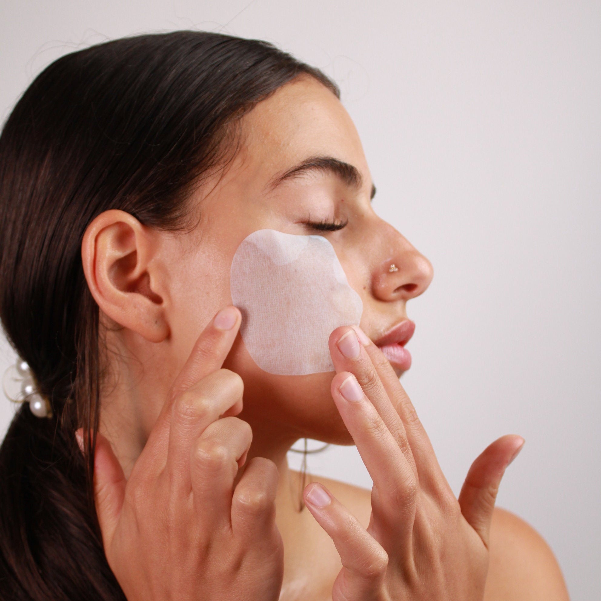 woman using melting mask collagen skincare on check