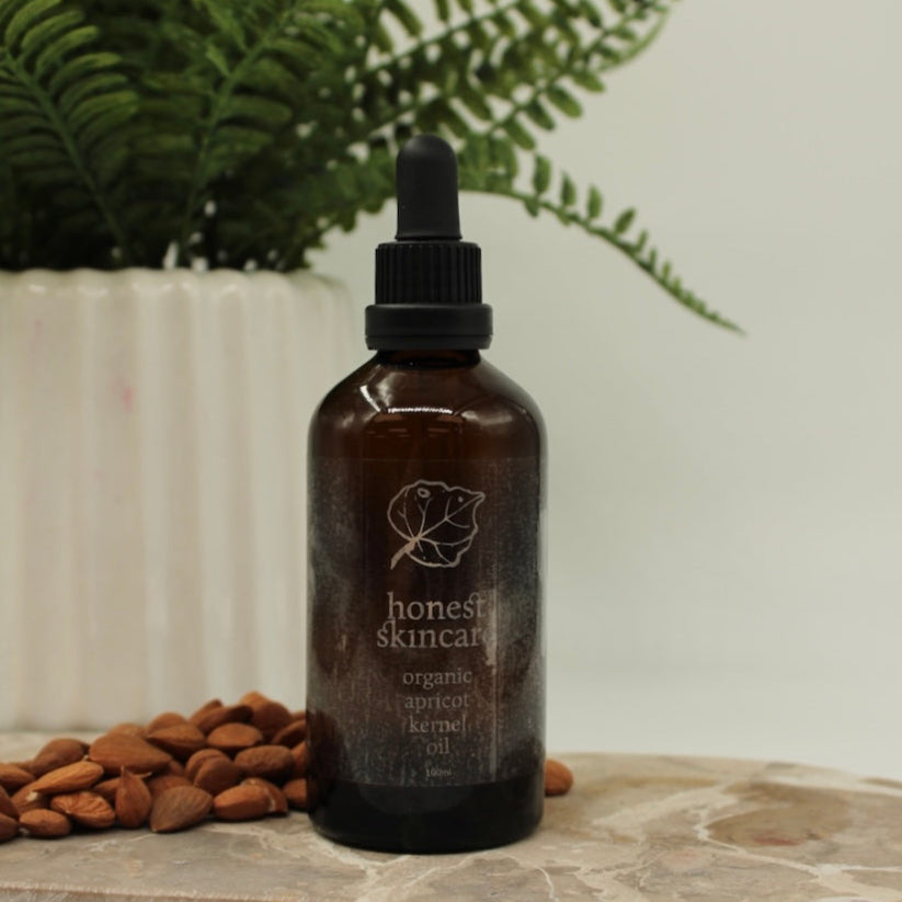 Bottle with Dropper of 100ml Organic Apricot Kernel Oil Natural Background