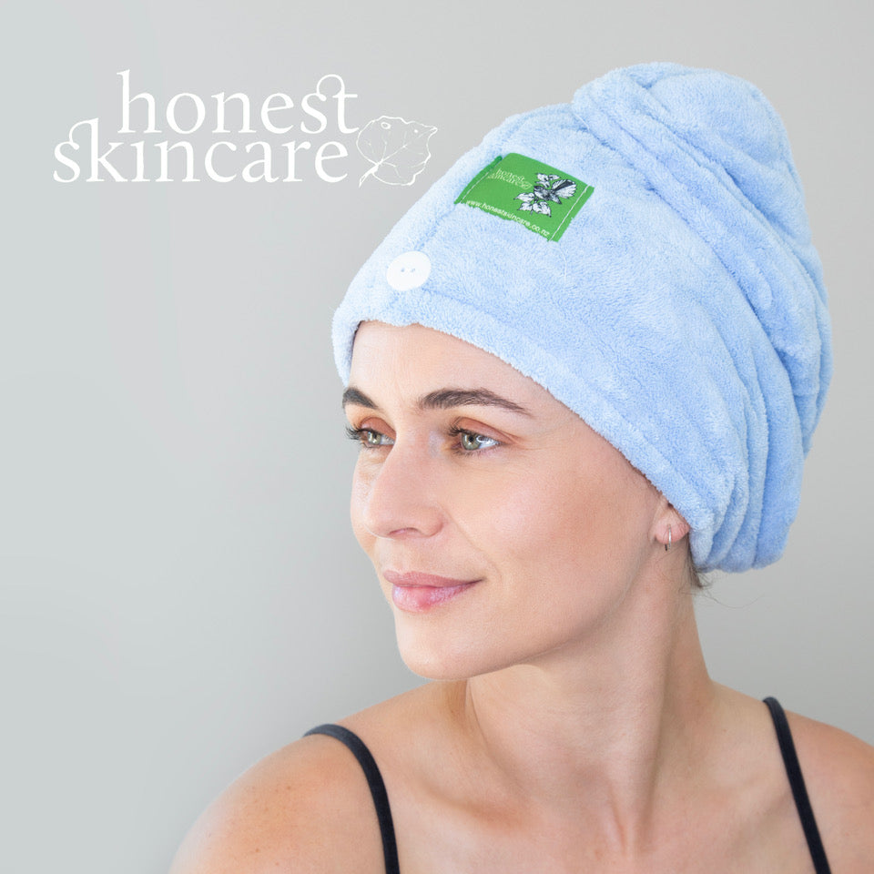 Woman wearing a blue wrap from Honest Skincare, showcasing comfort and style.