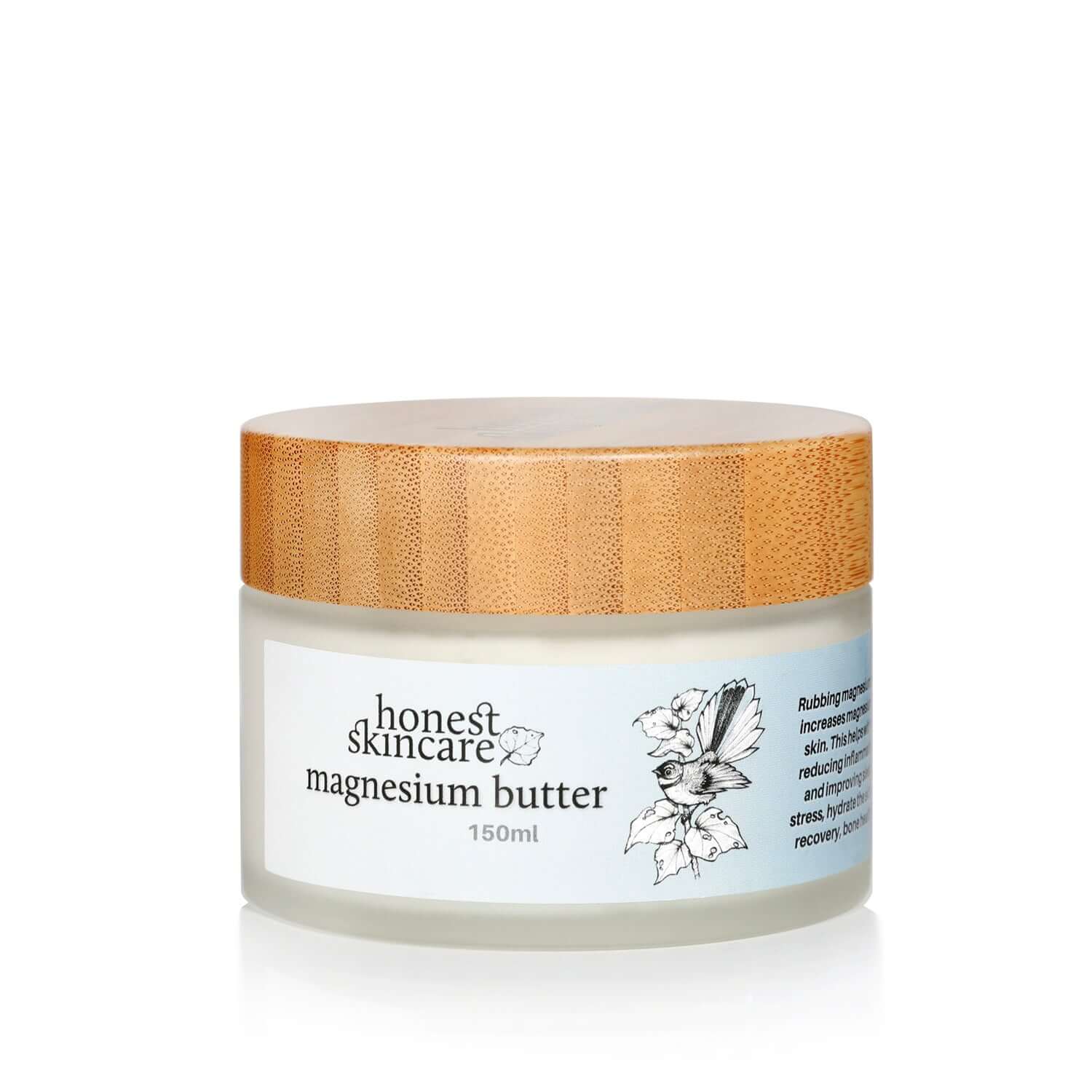 Jar of honest skincare magnesium butter with a wooden lid on a white background