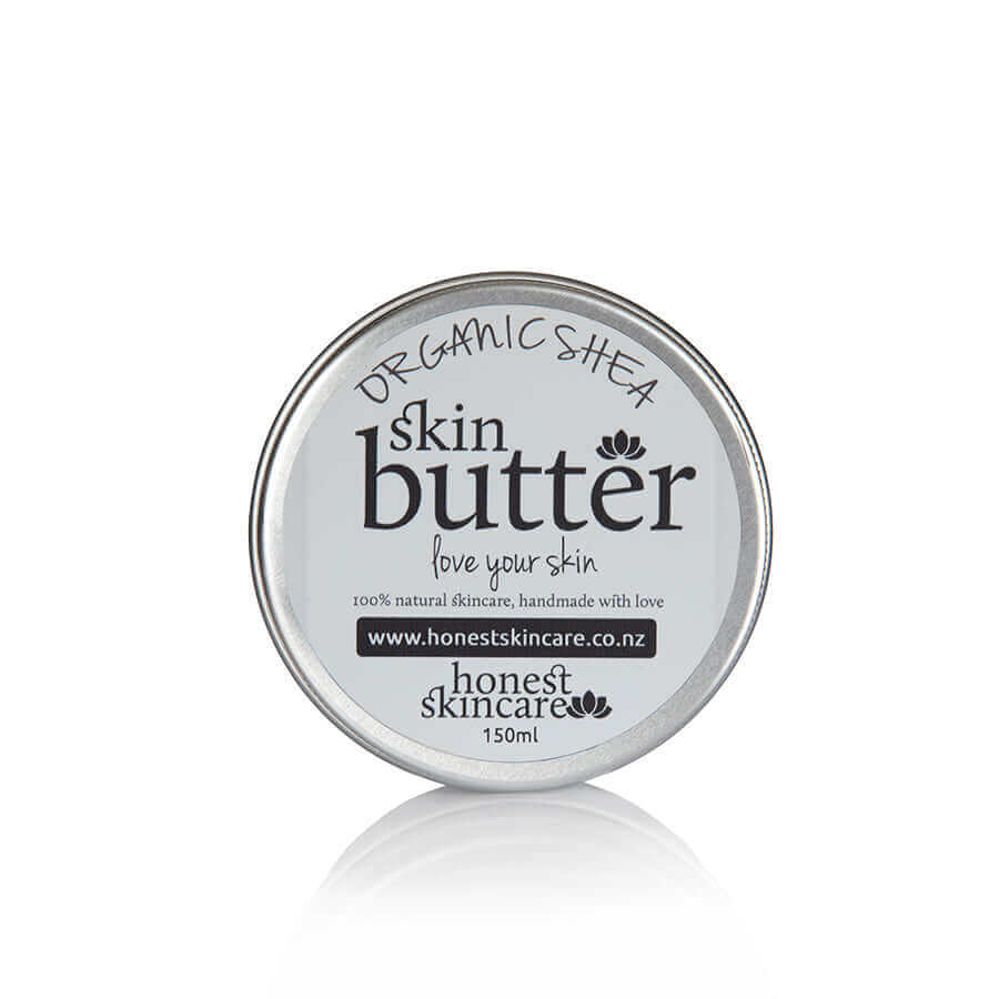 Container of organic shea butter tin honest skincare with 'honest skincare' branding on a white background