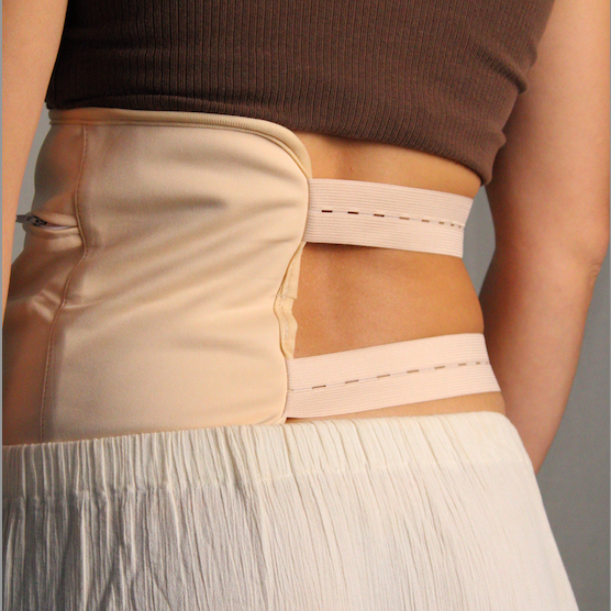 Person wearing a honest skincare beige waist wrap with a neutral background