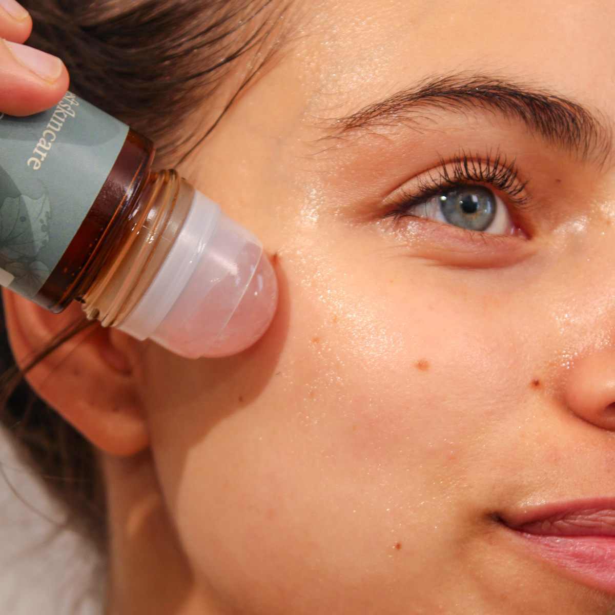Rose Quartz Roller with Certified Organic Castor Oil face glow