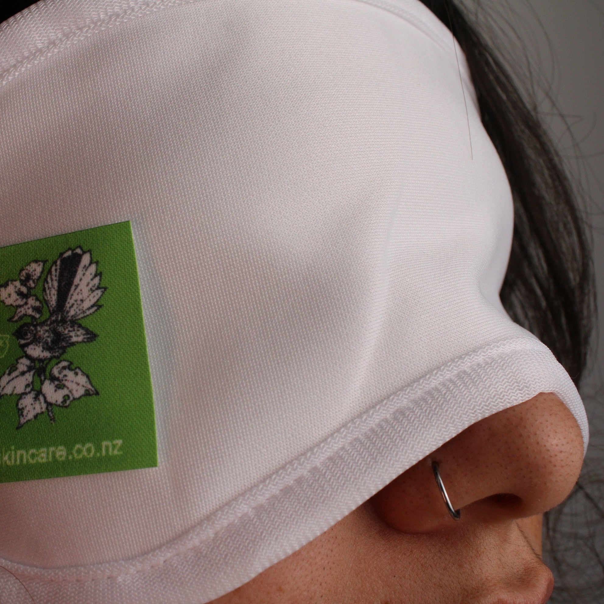 model wearing honest skincare organic castor oil cotton eye wrap close up