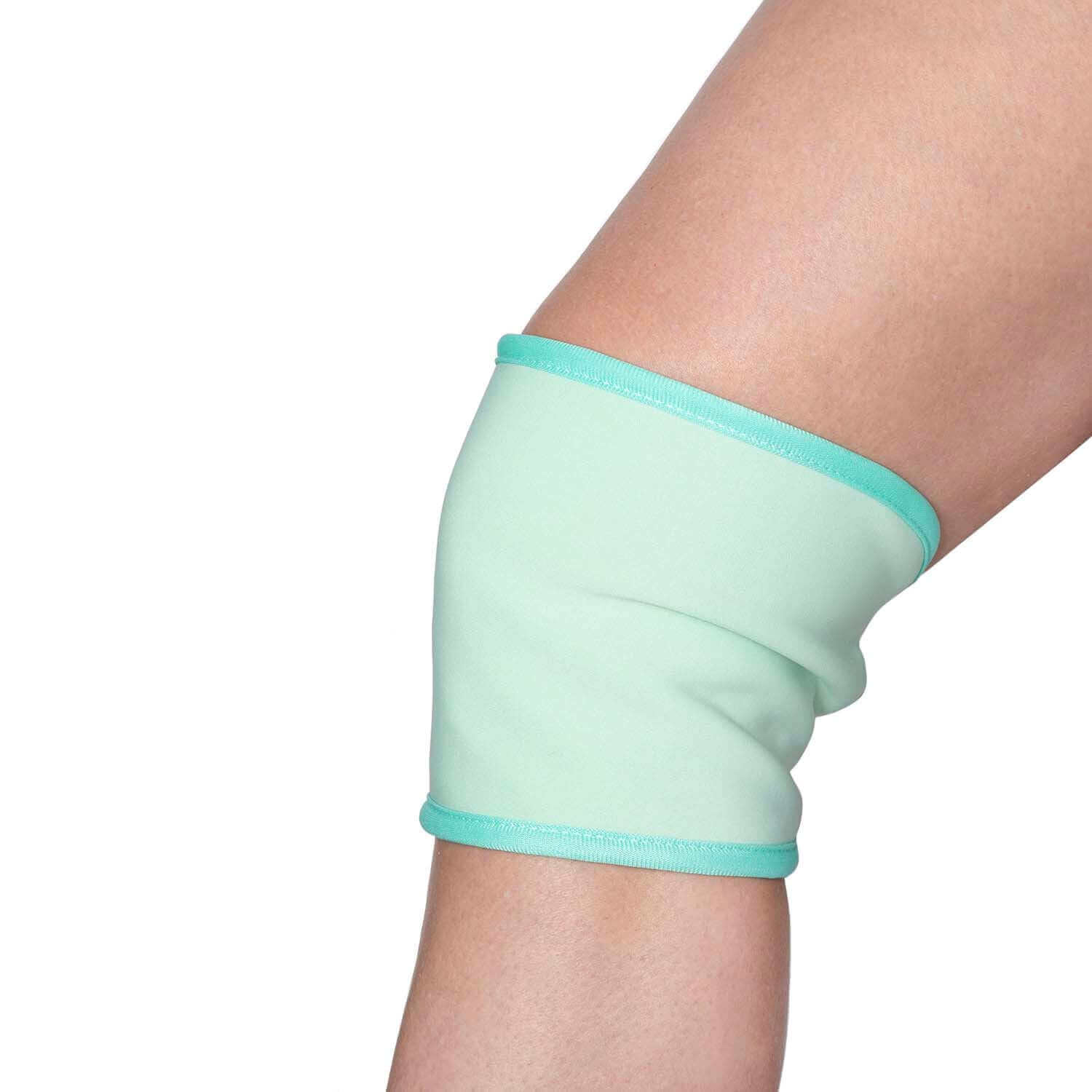 honest skincare Castor Oil Pack wrapped around a person's knee for natural wellness and healing benefits.